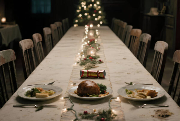 MOSSBEARD - Empty chairs at Christmas time song cover art depicting a Christmas table setting with 18 empty chairs and only two have placed have been set.