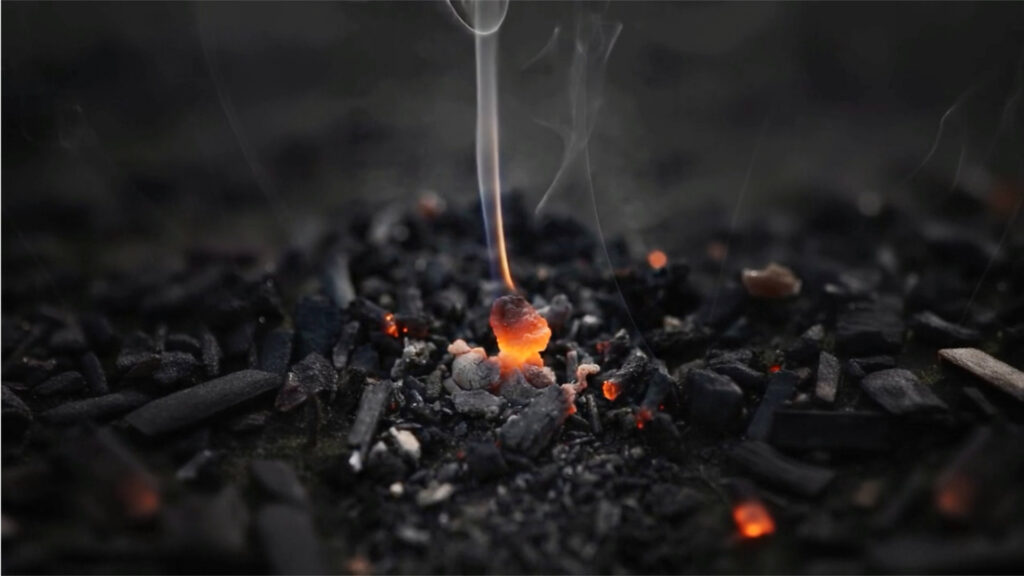 A bright coal burns brightly among the smouldering ash. From the Mossbeard song - Envy the dead.