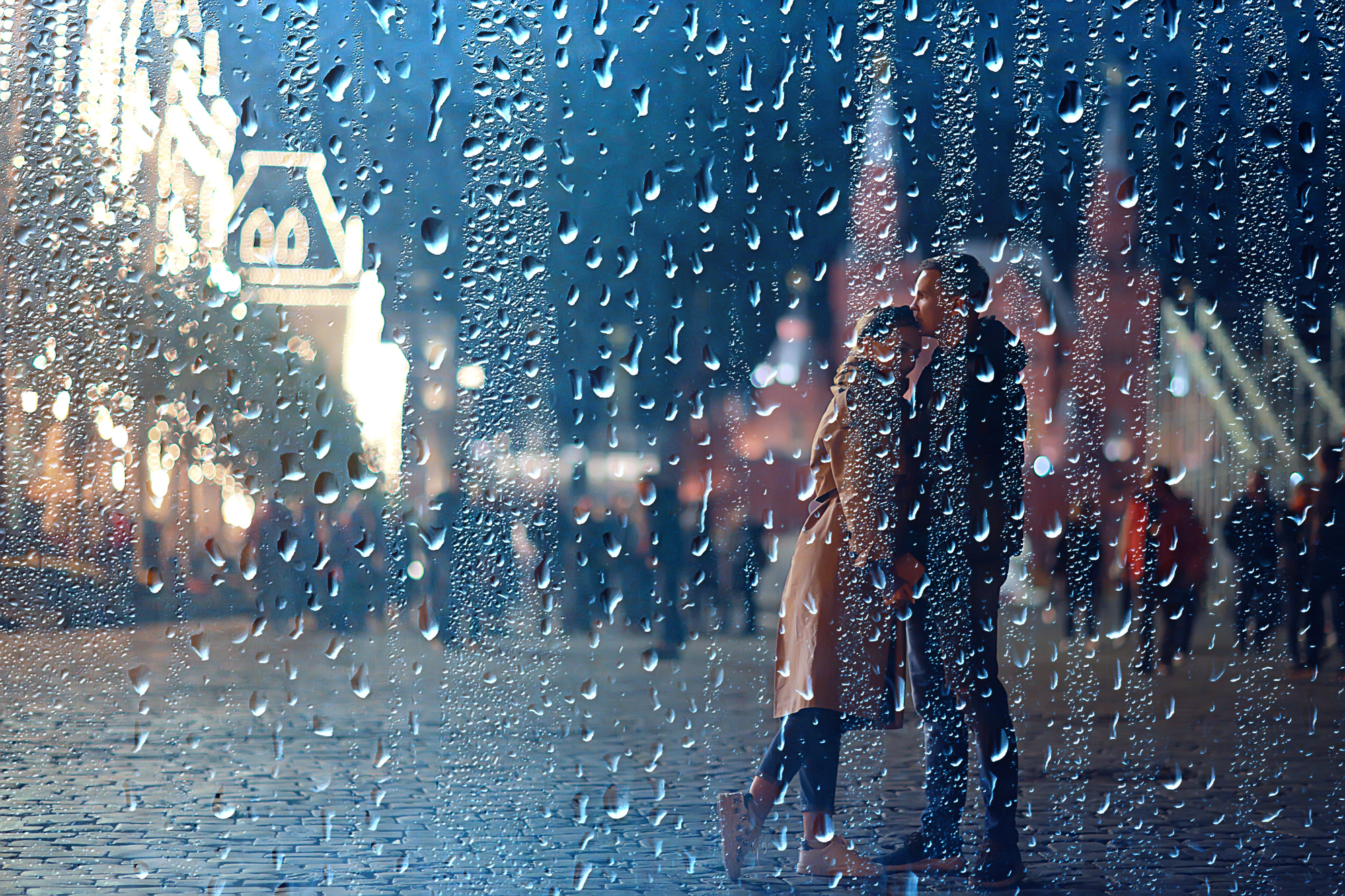 Mossbeard - All the almosts - A man and a woman embrace on a street corner in the rain,